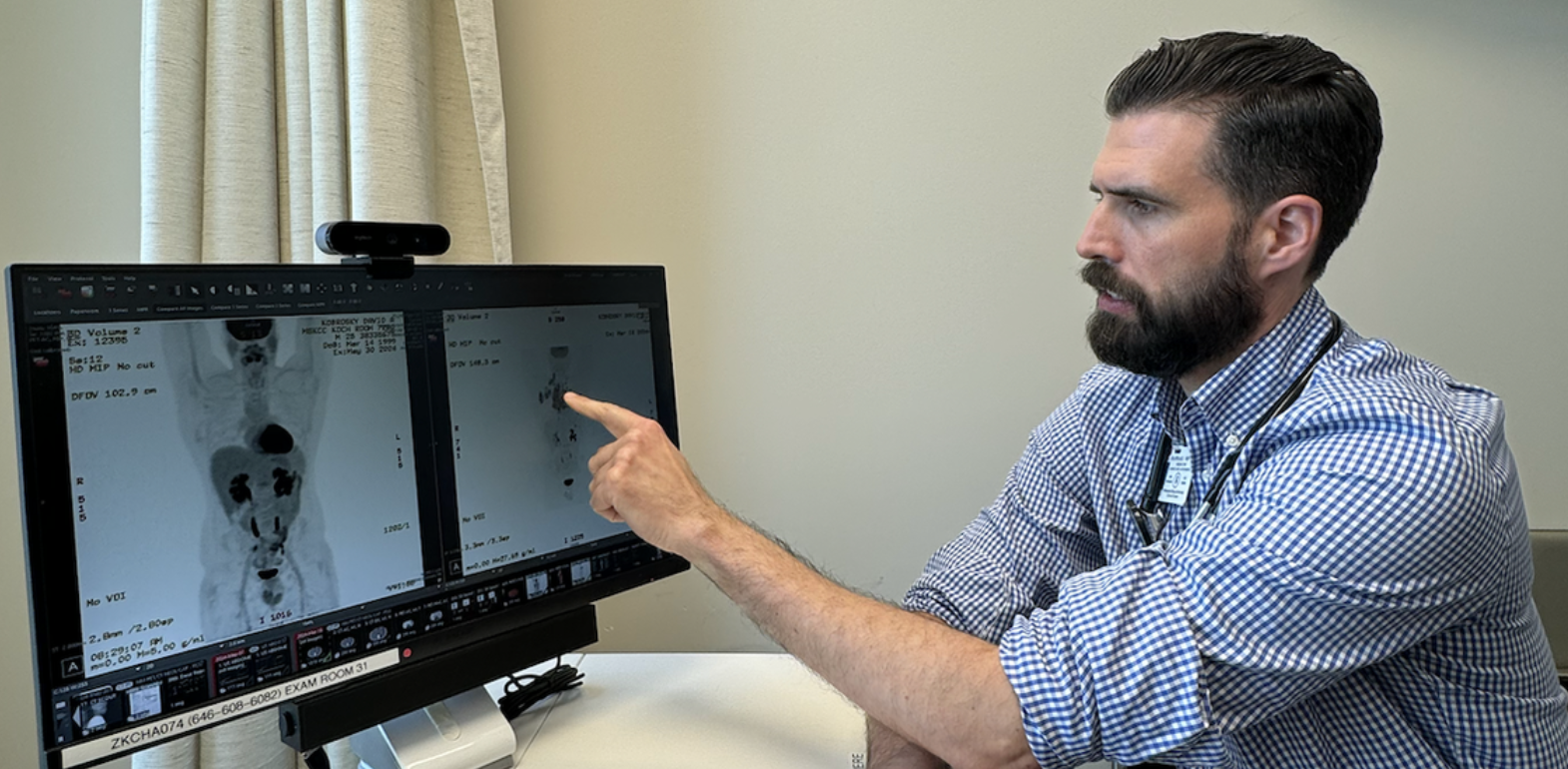 Dr. Handsome reviewing PET scan results